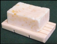 Natural soap on a natural pine wood soap dish