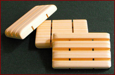 3 wide groves in a wood soap dish